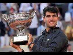 Alcaraz wins third Grand Slam title at 21